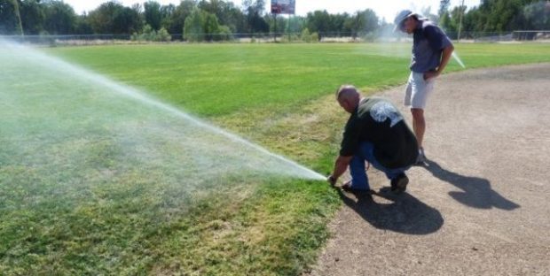 Workers at an irrigation repair in Redding, CA